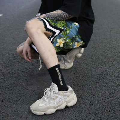 Pantalones cortos de playa holgados con estampado floral